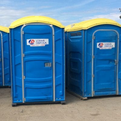 127836386-blue-plastic-compact-mobile-toilet-near-gray-wall portable toilet rentals